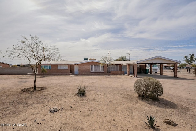 ranch-style home with brick siding and driveway