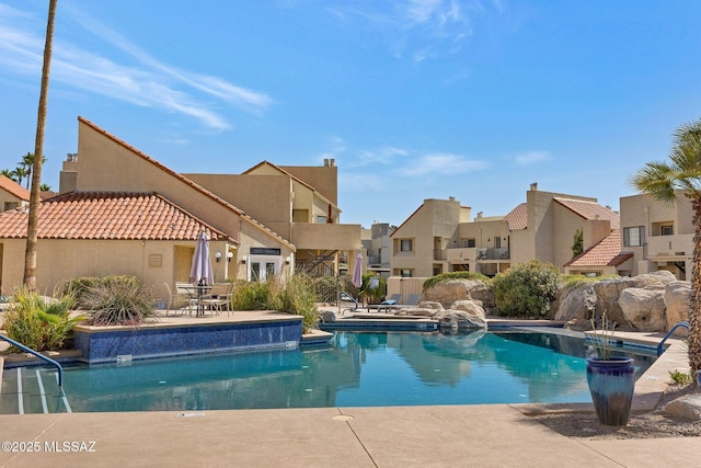 outdoor pool with a patio