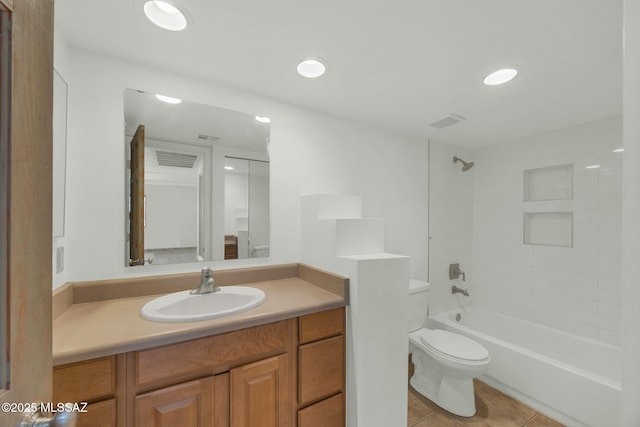 full bathroom featuring toilet, shower / bath combination, visible vents, vanity, and tile patterned floors