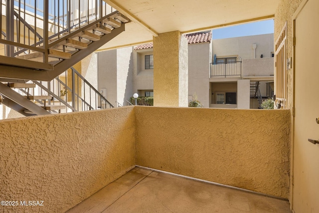 balcony featuring stairs