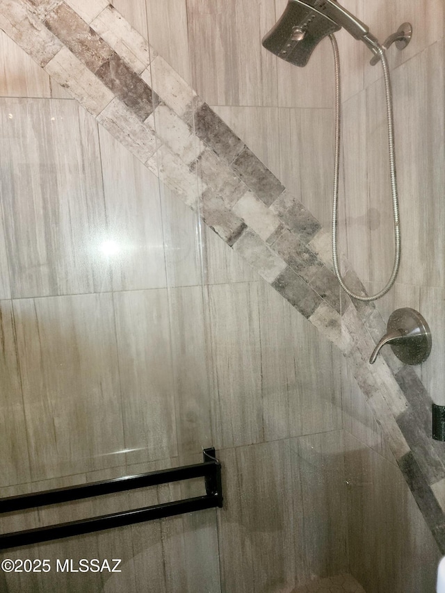 room details with a tile shower