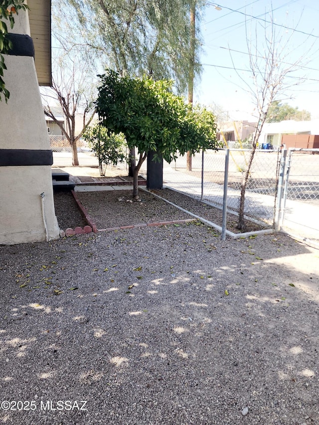 view of yard with a gate and fence