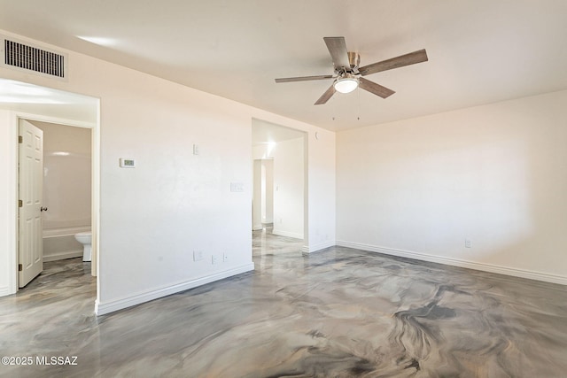 unfurnished room with a ceiling fan, visible vents, finished concrete flooring, and baseboards