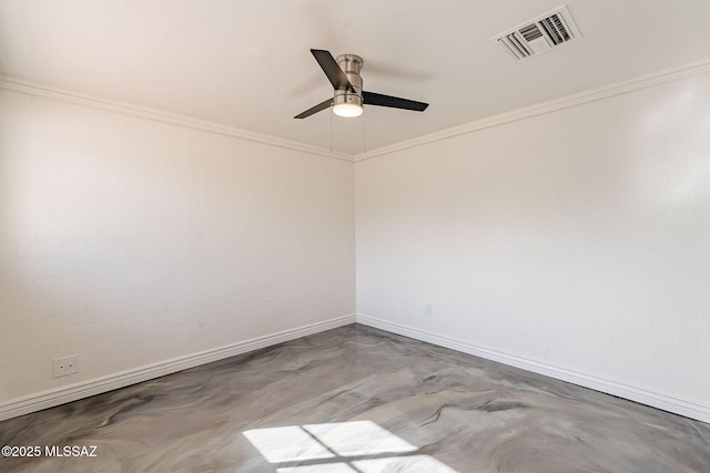 spare room with ornamental molding, visible vents, and baseboards