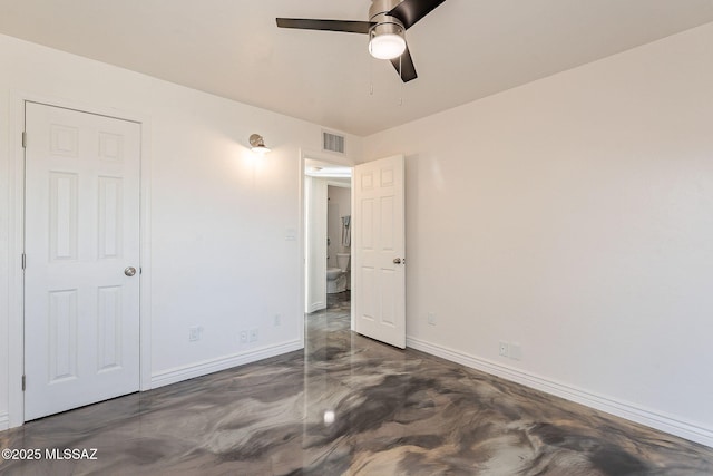 unfurnished bedroom featuring finished concrete floors, visible vents, ceiling fan, and baseboards