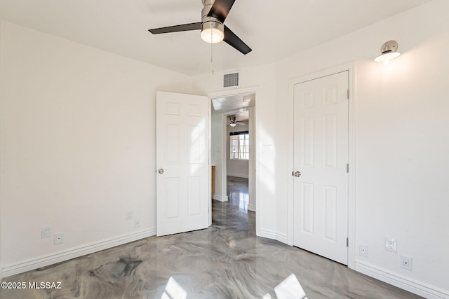 unfurnished bedroom with finished concrete flooring, baseboards, visible vents, and ceiling fan