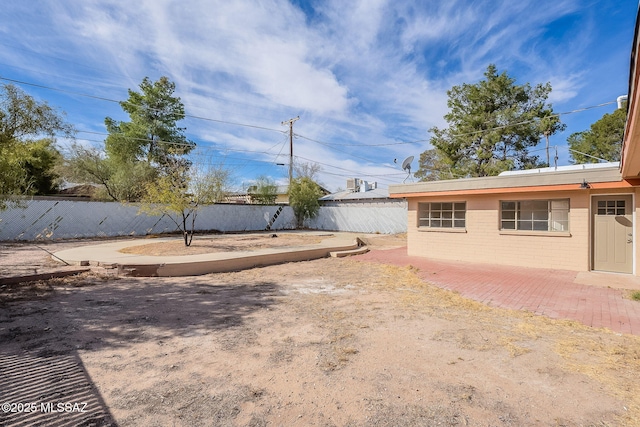 view of yard featuring a patio area and a fenced backyard