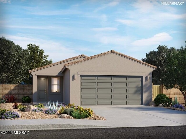 view of front of property with concrete driveway, a tile roof, an attached garage, fence, and stucco siding