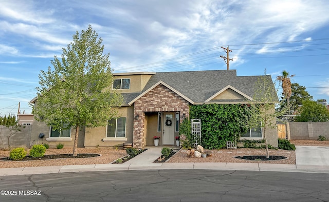 1785 Camilla Cir, Safford, AZ 85546 - view of front of home with fence, stone siding, a shingled roof, and stucco siding