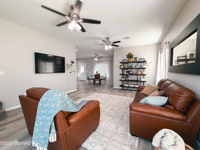 1785 Camilla Cir, Safford, AZ 85546 - living area featuring ceiling fan, baseboards, visible vents, and wood finished floors