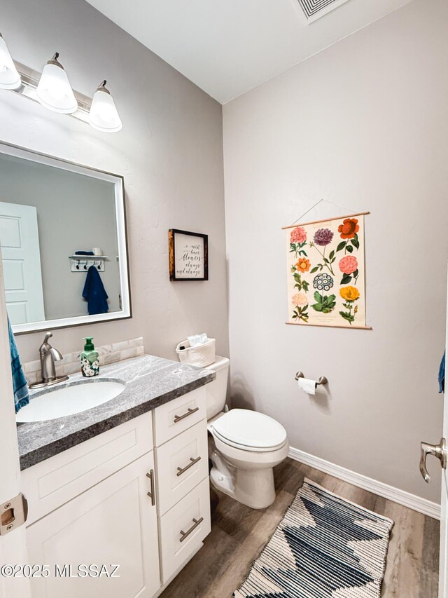 1785 Camilla Cir, Safford, AZ 85546 - bathroom with toilet, vanity, wood finished floors, and baseboards