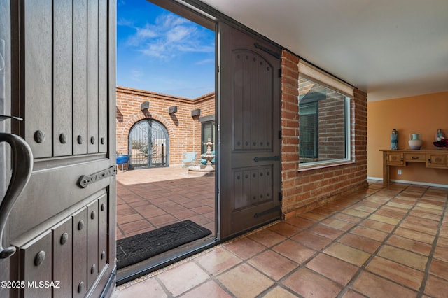 interior space featuring brick wall