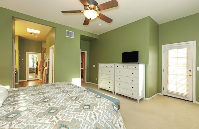 carpeted bedroom featuring access to exterior, visible vents, ceiling fan, and baseboards