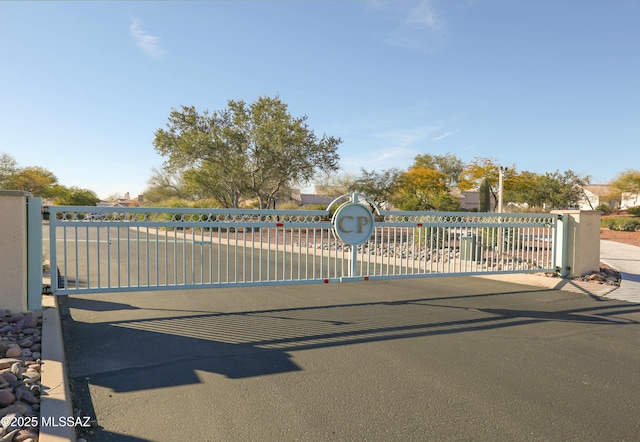 view of gate with fence