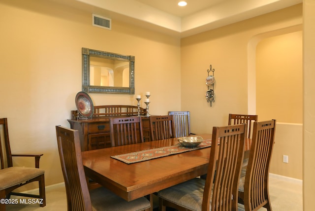 carpeted dining area featuring baseboards, visible vents, and recessed lighting