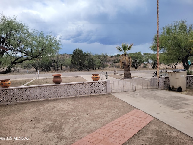 view of patio featuring a gate