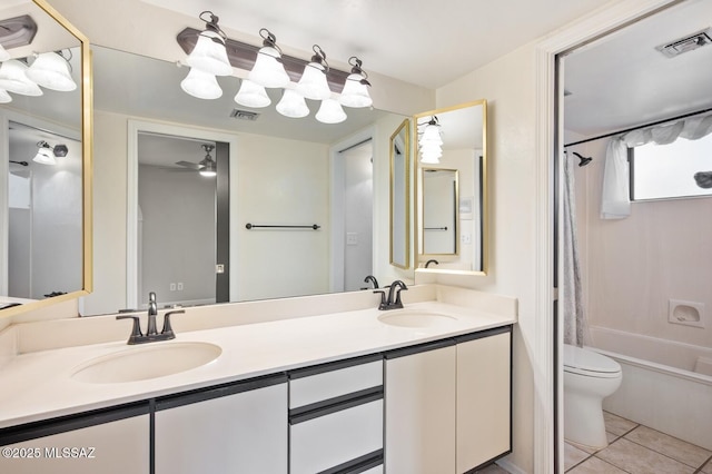 bathroom with shower / tub combo, visible vents, and a sink