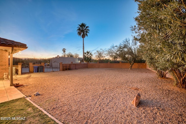 view of yard featuring a gate and fence