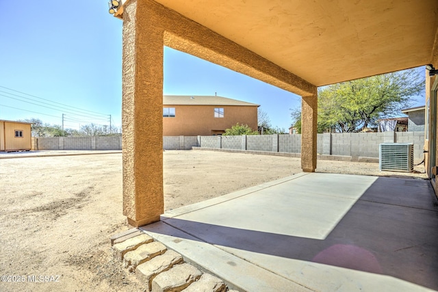 view of patio with a fenced backyard and cooling unit