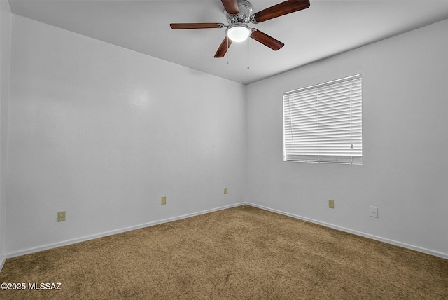 unfurnished room featuring ceiling fan, carpet floors, and baseboards