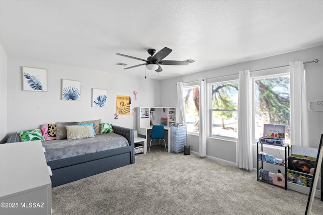 living area featuring visible vents, ceiling fan, baseboards, and carpet floors