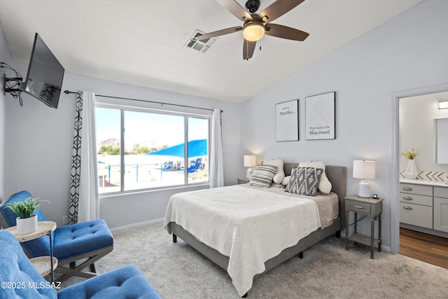 carpeted bedroom featuring visible vents, ceiling fan, lofted ceiling, and baseboards
