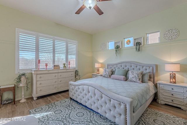 bedroom featuring ceiling fan and wood finished floors