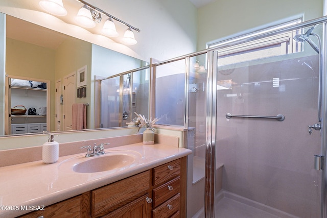 full bathroom featuring a stall shower and vanity