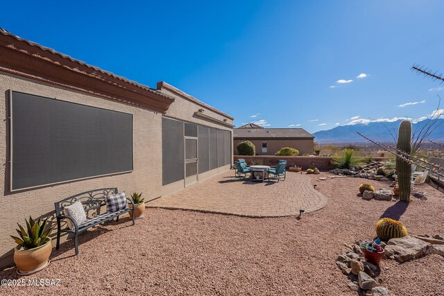 view of yard with a patio and a mountain view