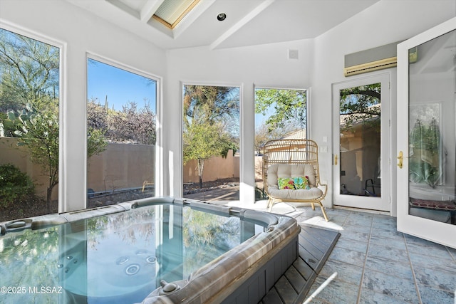 sunroom with vaulted ceiling, visible vents, and a jacuzzi