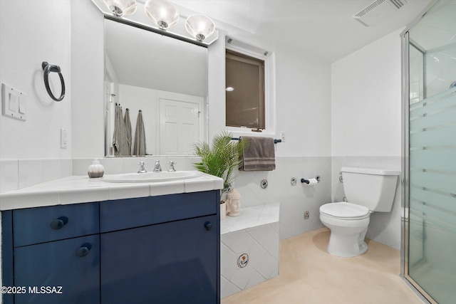 bathroom with visible vents, toilet, tile patterned floors, vanity, and a shower stall