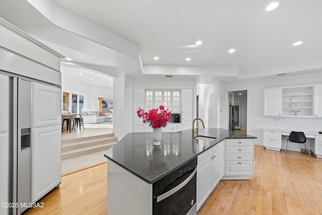 kitchen featuring open shelves, white cabinets, and light wood-style floors