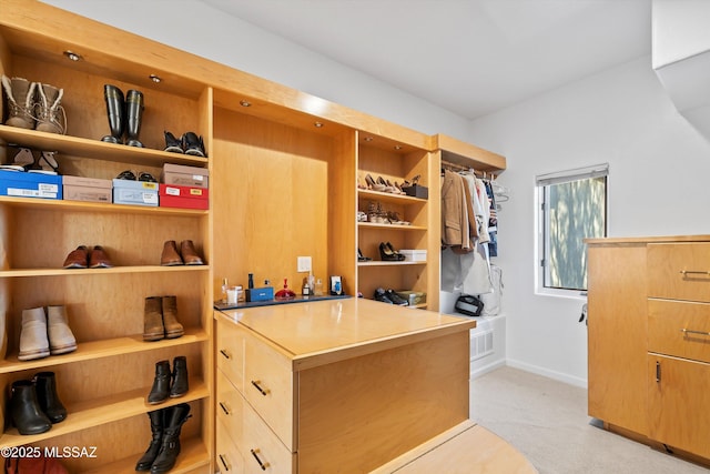 spacious closet featuring light carpet and visible vents