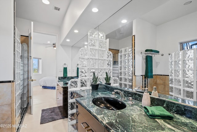 ensuite bathroom with visible vents, a ceiling fan, ensuite bathroom, vanity, and recessed lighting