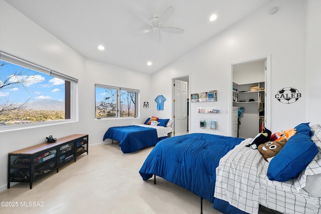 bedroom with a walk in closet, recessed lighting, a closet, ceiling fan, and vaulted ceiling