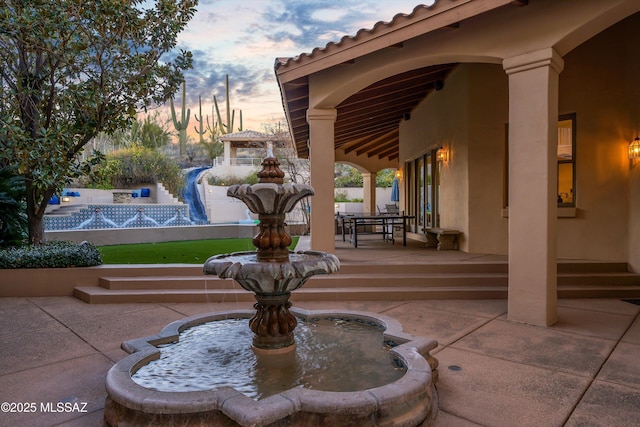 surrounding community featuring a patio area