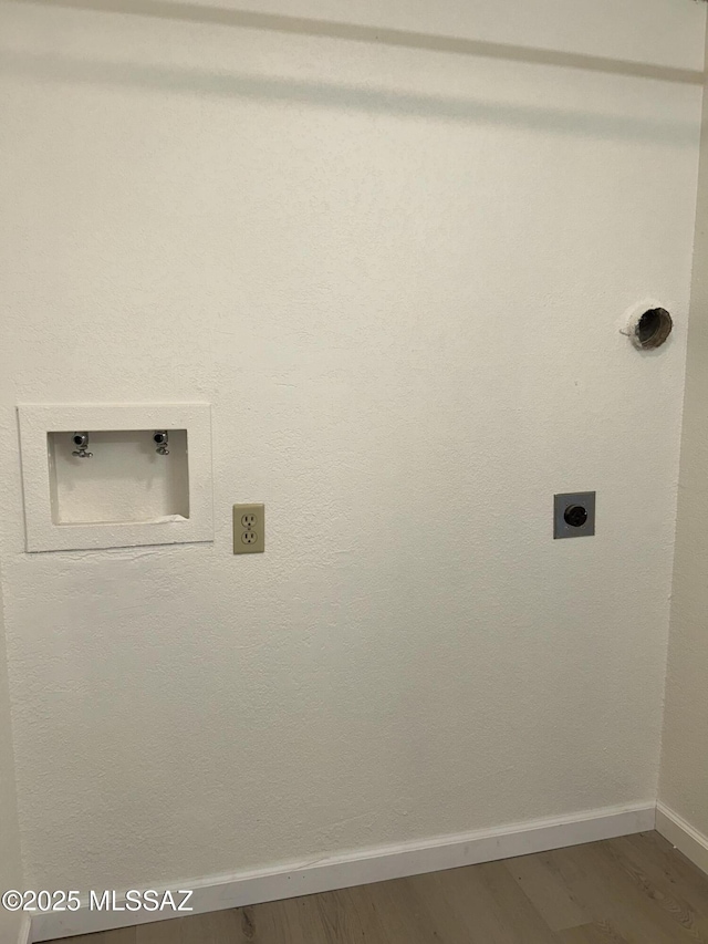 laundry area with hookup for a washing machine, laundry area, hookup for an electric dryer, and wood finished floors