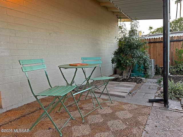 view of patio / terrace featuring fence