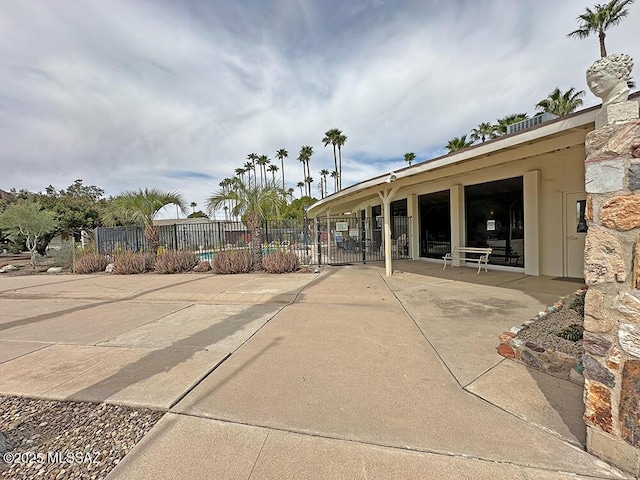 exterior space featuring fence and a patio