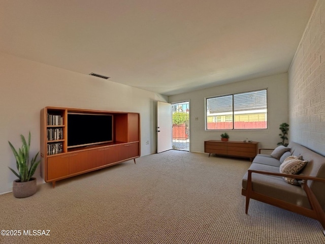 living area with carpet and visible vents