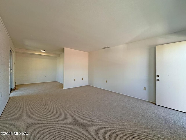 empty room featuring light carpet and visible vents