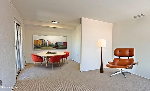 living area featuring carpet flooring and visible vents
