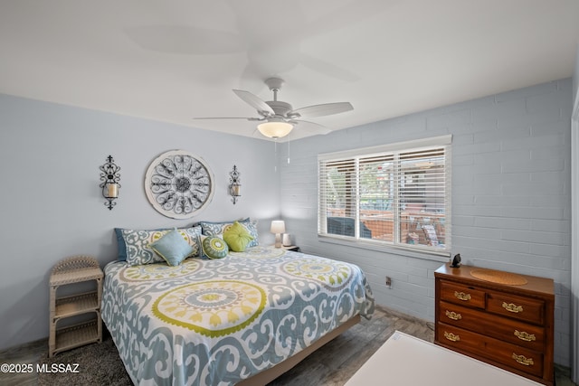 bedroom featuring wood finished floors and a ceiling fan