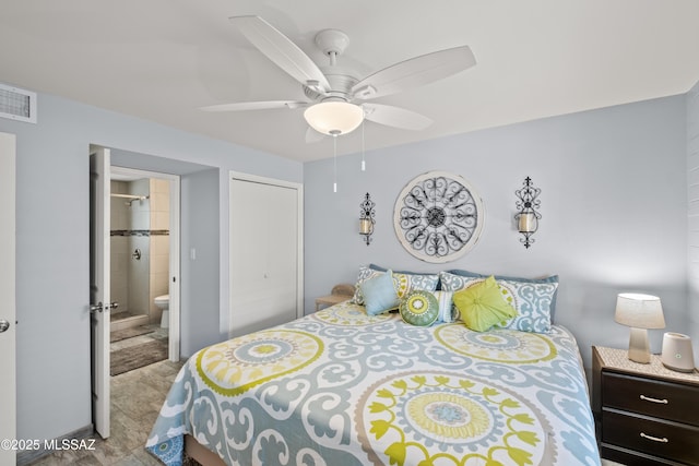 bedroom featuring ceiling fan, visible vents, and ensuite bathroom