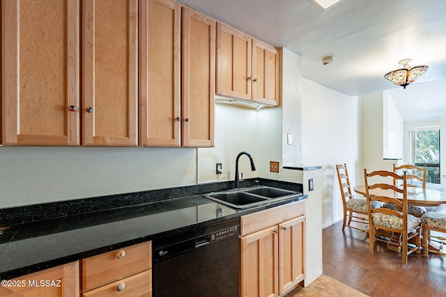 kitchen with a sink, black dishwasher, wood finished floors, and light brown cabinets