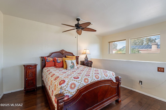 bedroom featuring baseboards, a ceiling fan, and hardwood / wood-style flooring