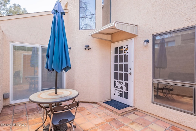 doorway to property with stucco siding