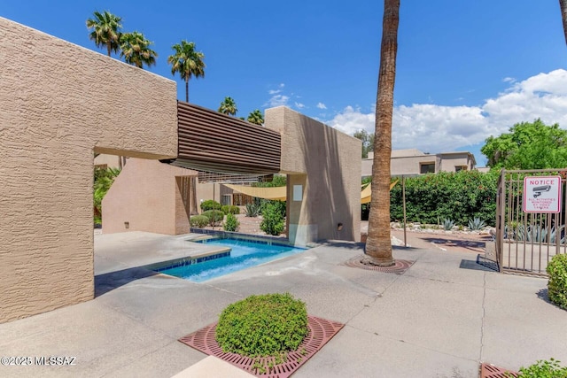 community pool with a patio area