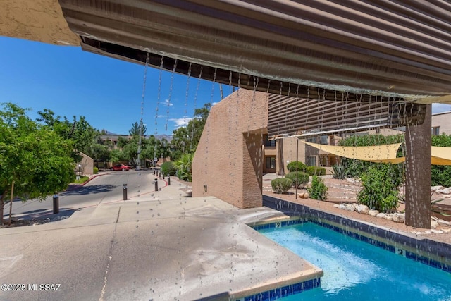 view of swimming pool featuring a pool and a patio area