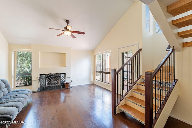 living room featuring plenty of natural light, a fireplace, and hardwood / wood-style floors